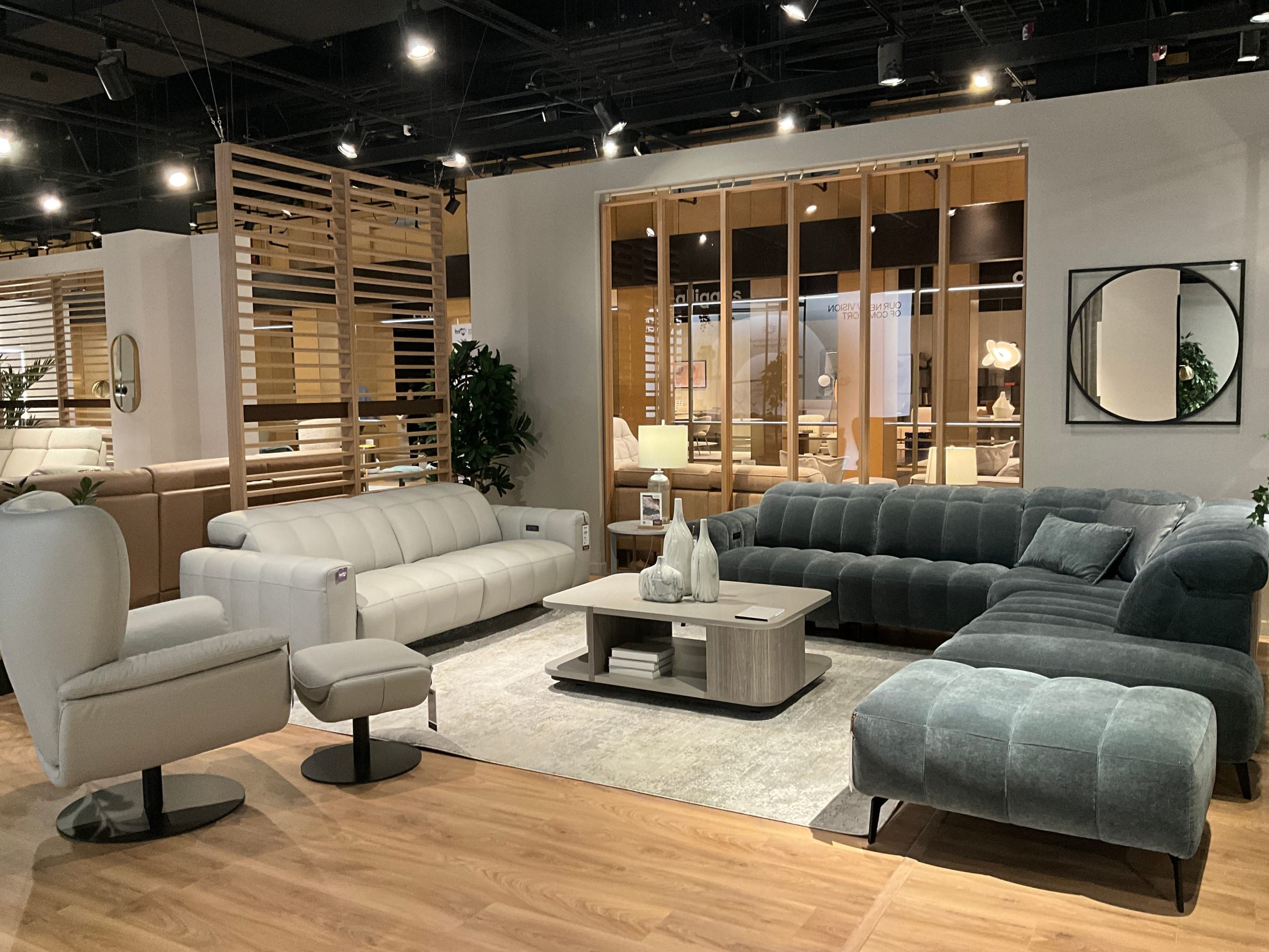 Entry view of the Natuzzi market showroom showing the first grouping a buyer encounters.