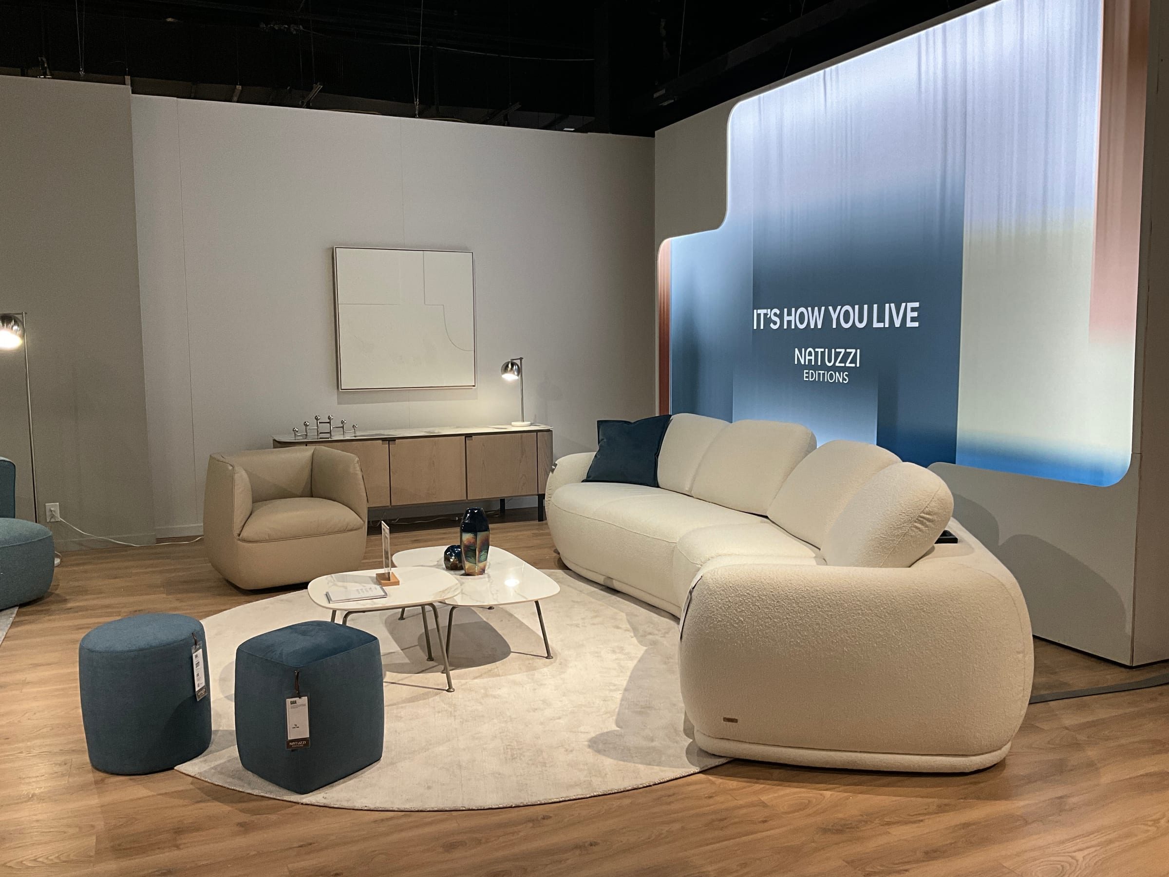 Second grouping showing a different price and material story in the same showroom.