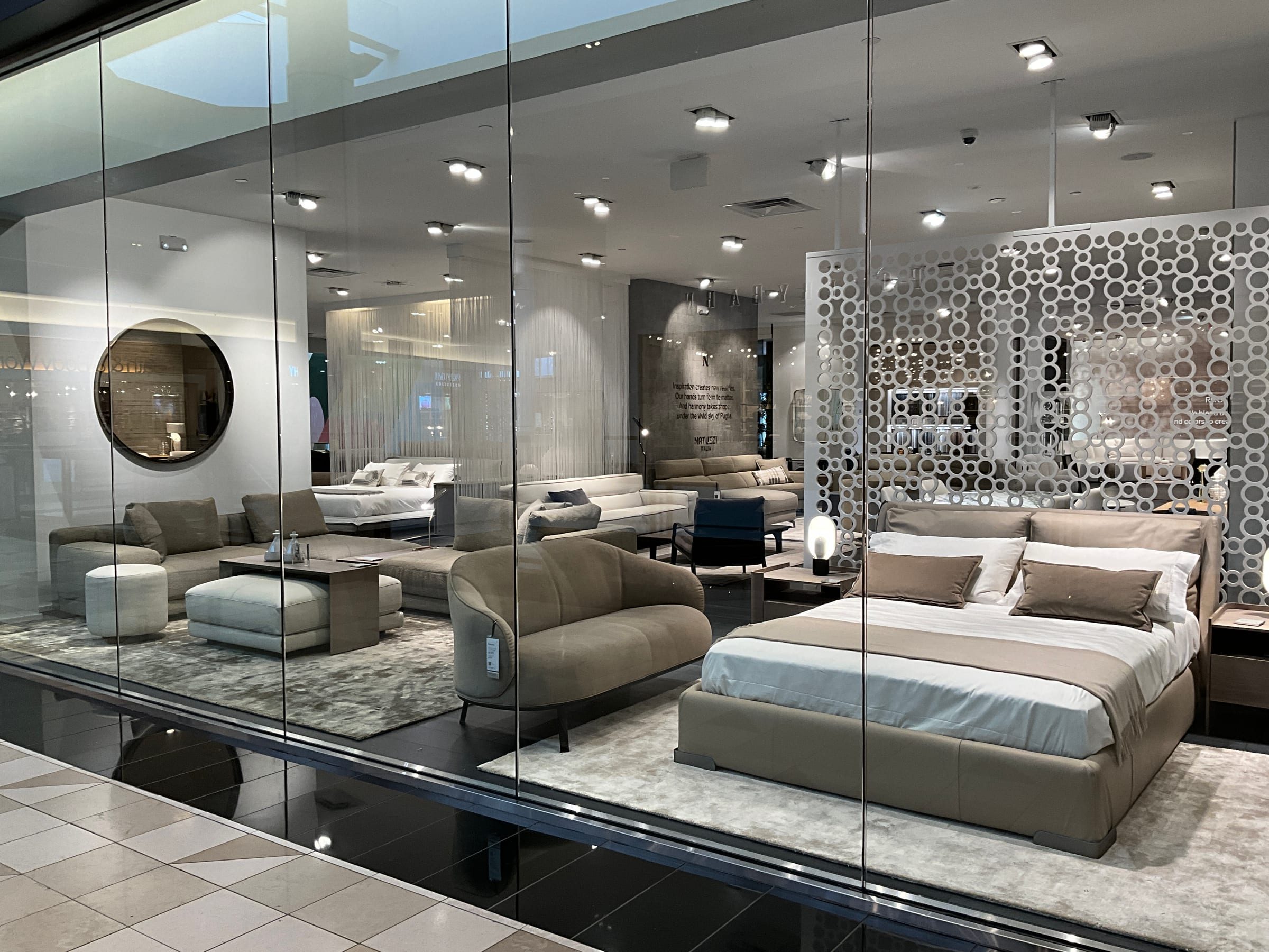 Upholstery grouping with occasional tables and lighting.