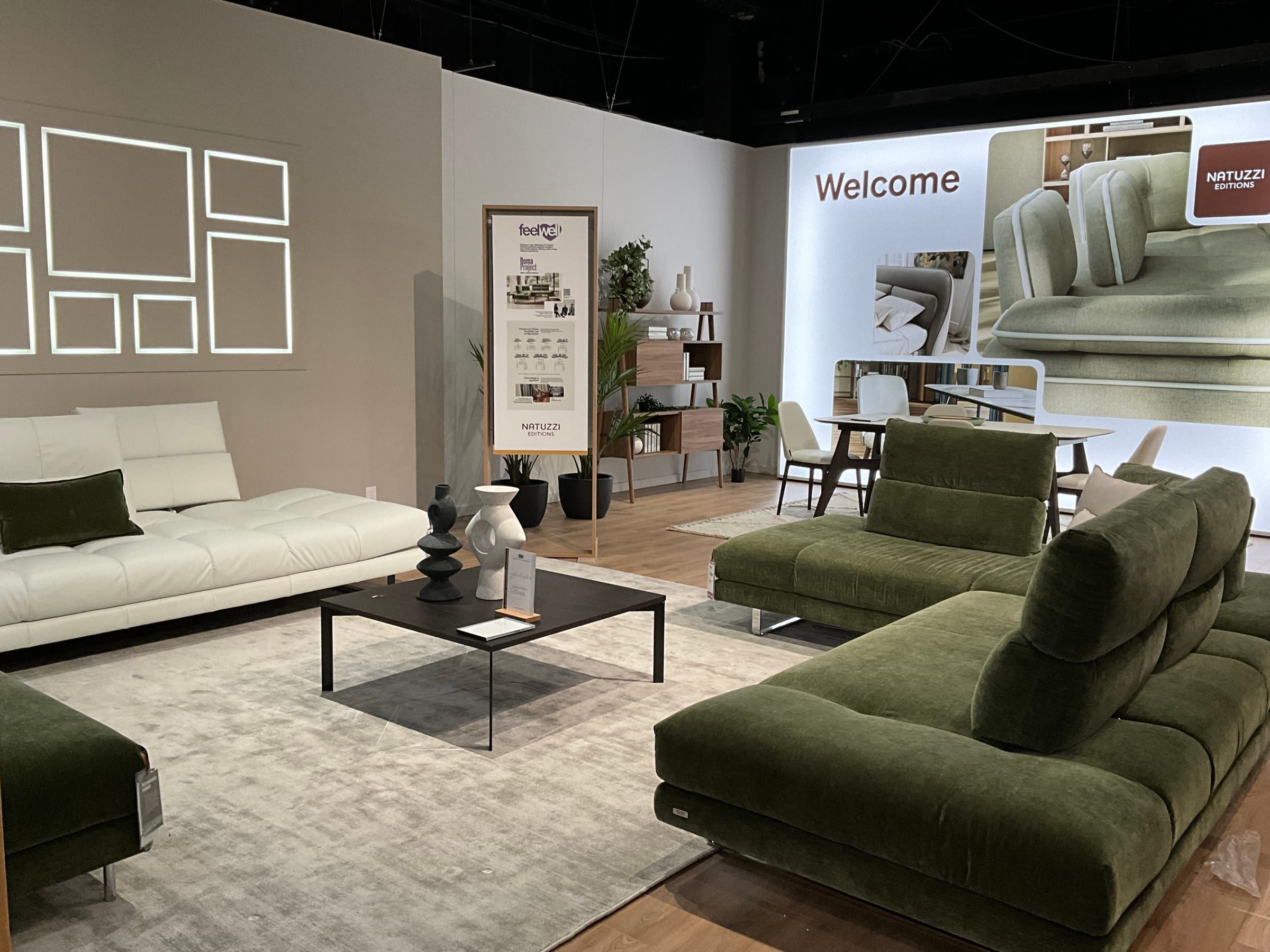Welcome entrance signage and branded backdrop at the Natuzzi Editions market showroom.